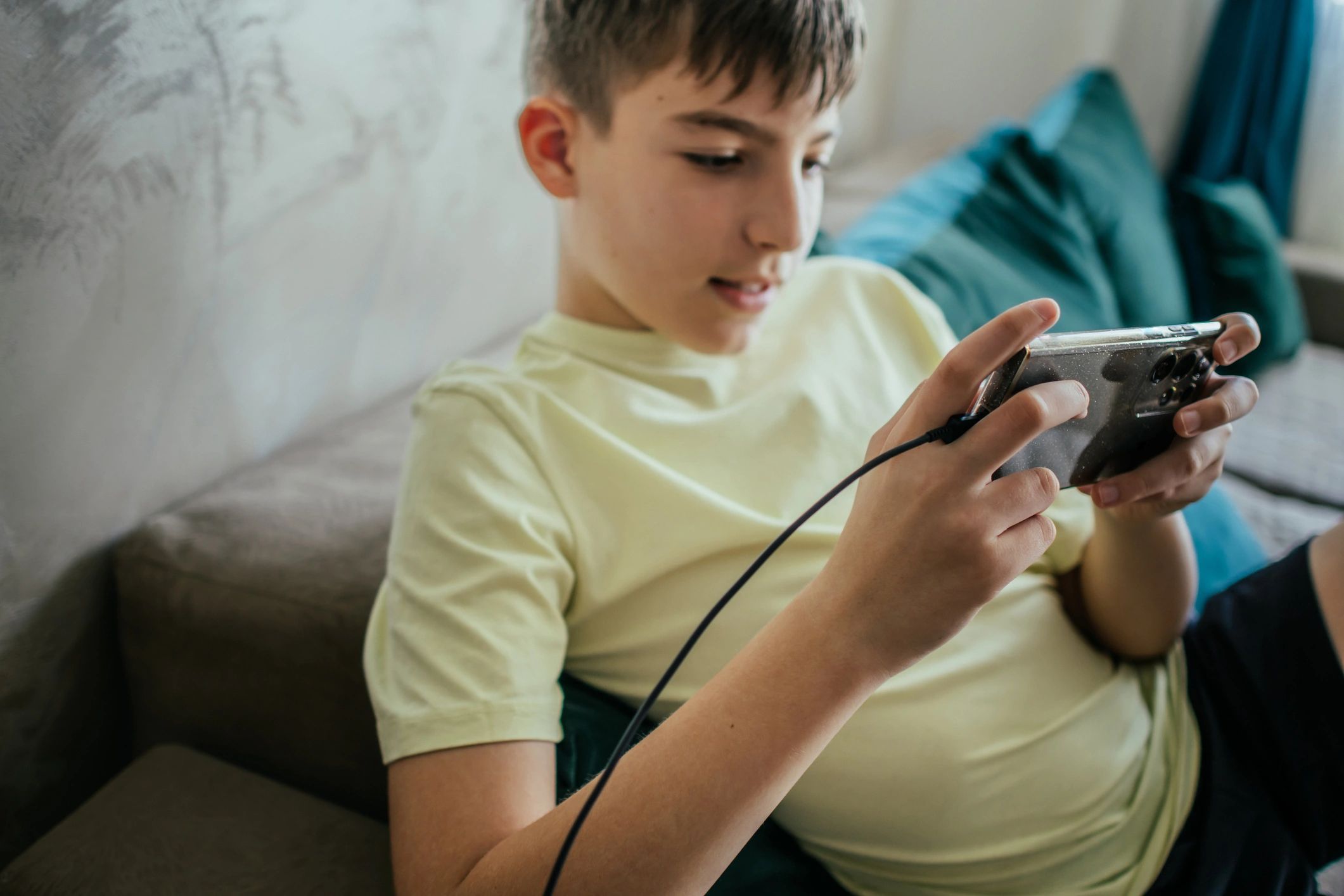 Young gamer enjoying a mobile game